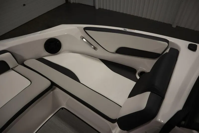 Slide: The Image of 2025 Yamaha Boats 195 SX interior seating with sleek black and white design. - 17
