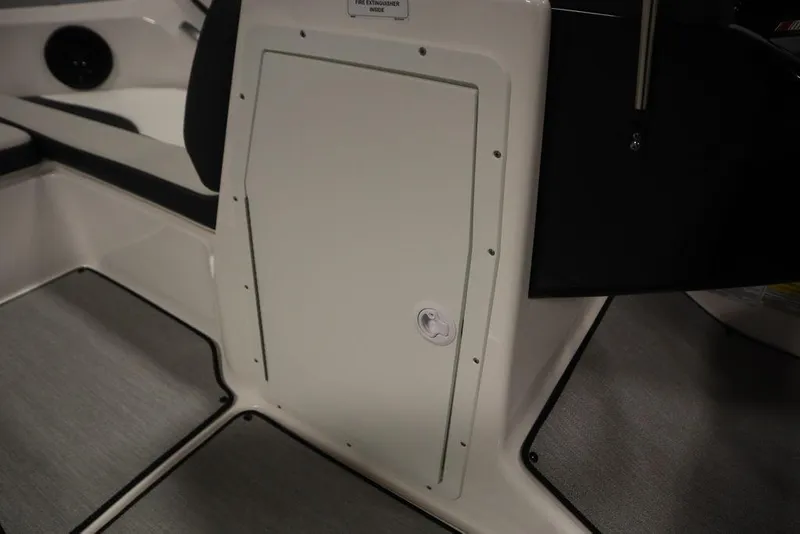 Slide: The Image of Interior view of 2025 Yamaha Boats 195 SX, featuring storage compartment and seating area. - 18