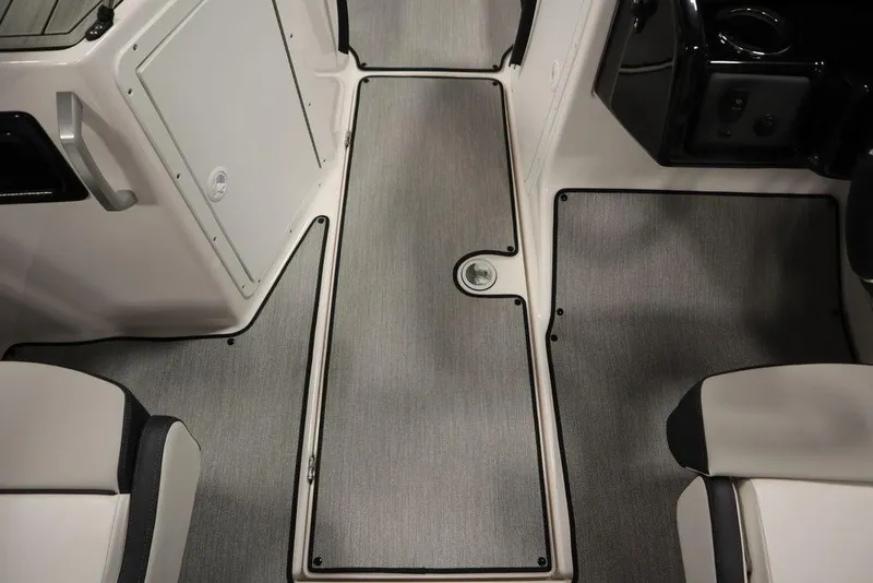 Slide: The Image of 2025 Yamaha Boats 195 SX interior with sleek gray flooring and modern seating. - 20