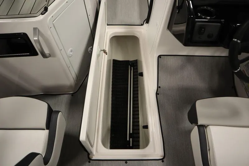 Slide: The Image of Interior view of 2025 Yamaha Boats 195 SX, featuring storage compartment and seating. - 21
