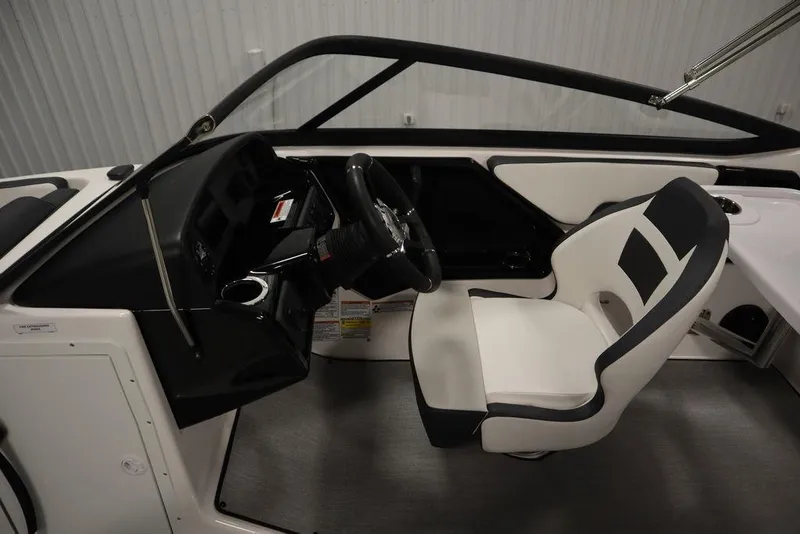 Slide: The Image of 2025 Yamaha Boats 195 SX interior with steering wheel and seating. - 22