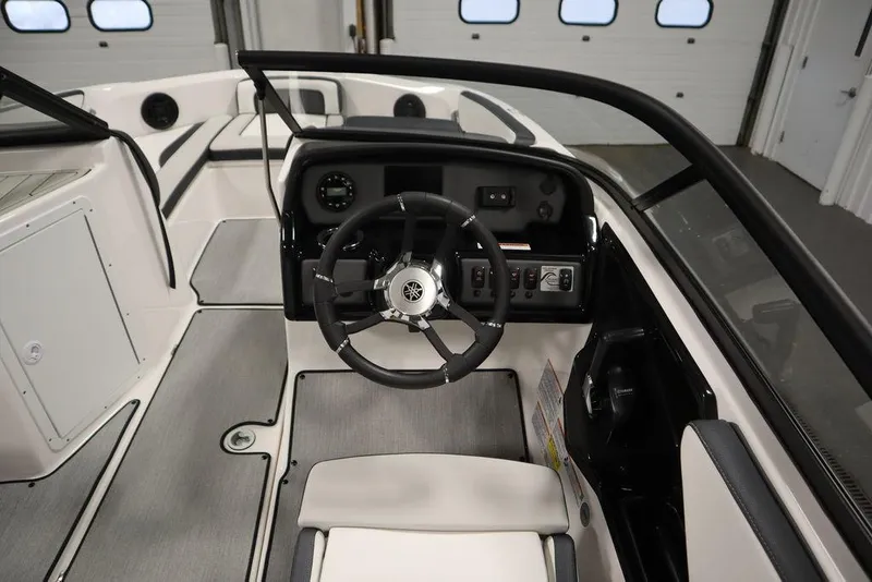 Slide: The Image of 2025 Yamaha Boats 195 SX cockpit with steering wheel and dashboard controls. - 23