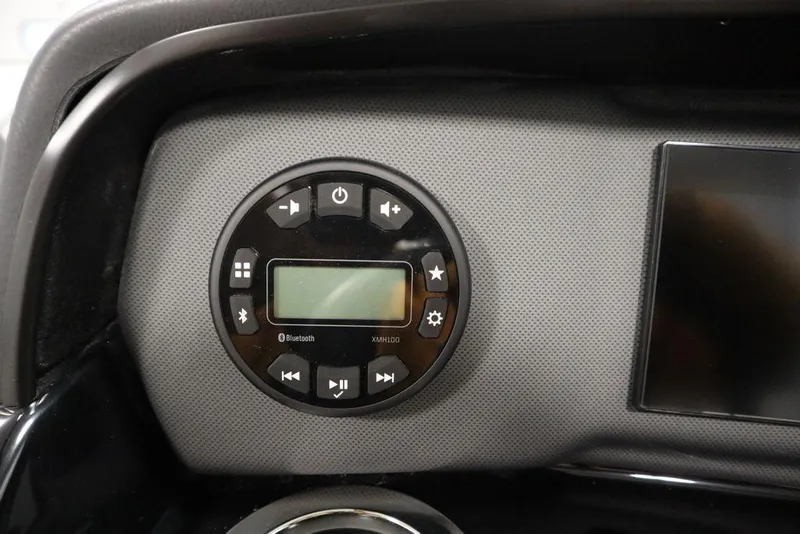 Slide: The Image of Control panel of 2025 Yamaha Boats 195 SX with digital display and buttons. - 25