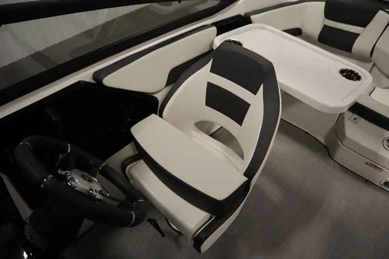 Slide: The Image of 2025 Yamaha Boats 195 SX interior with sleek black and white seating and steering wheel. - 32