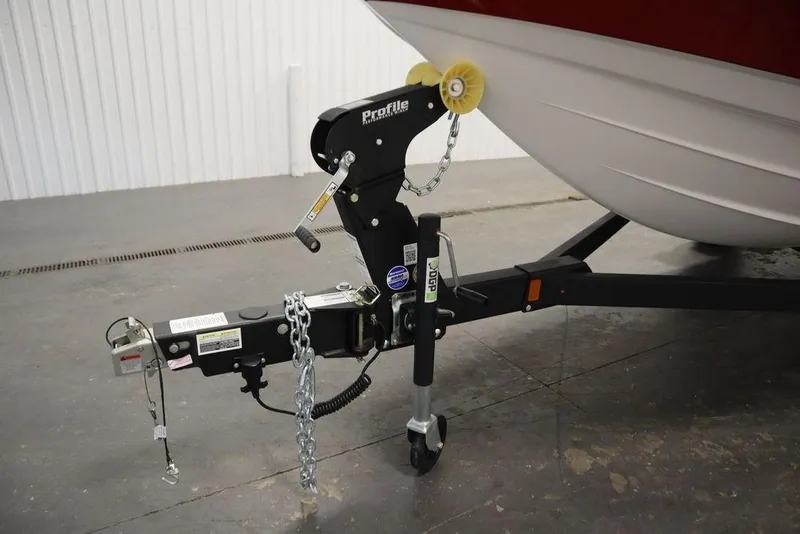 Slide: The Image of 2025 Yamaha Boats 195 SX trailer hitch in a garage setting. - 49