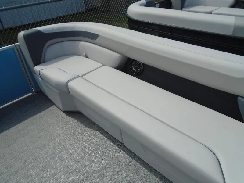 Slide: The Image of 2025 Godfrey Sweetwater 2286 C boat seating, featuring sleek white and gray upholstery. - 10