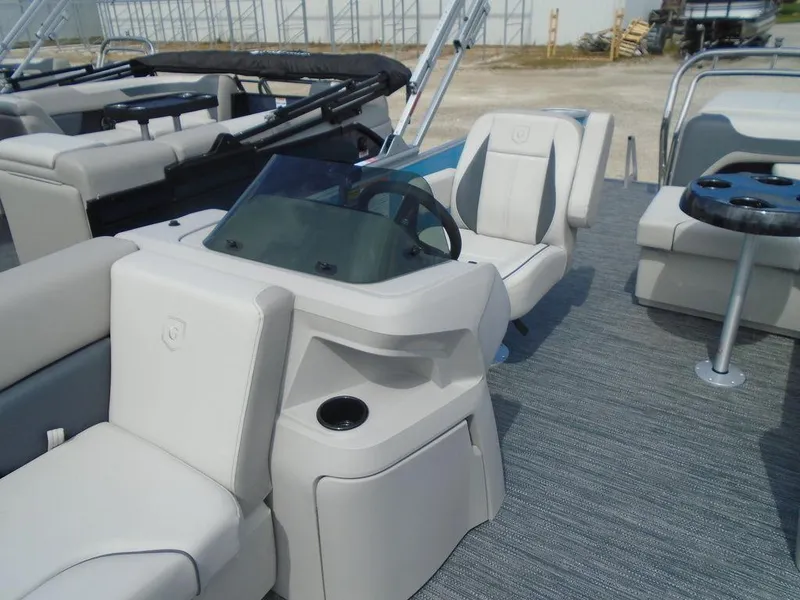 Slide: The Image of 2025 Godfrey Sweetwater 2286 C boat interior with helm and seating area. - 13