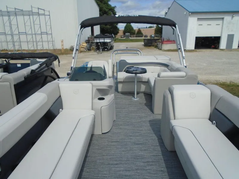 Slide: The Image of 2025 Godfrey Sweetwater 2286 C pontoon boat with spacious seating and canopy. - 17