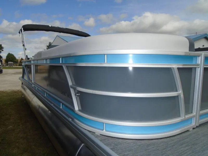 Slide: The Image of 2025 Godfrey Sweetwater 2286 C pontoon boat with blue and gray exterior. - 22