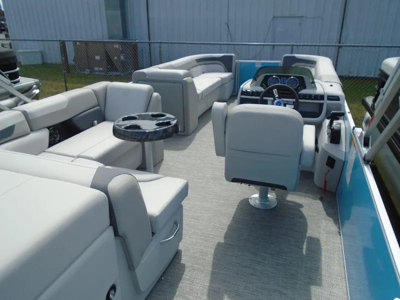 Slide: The Image of 2025 Godfrey Sweetwater 2286 C pontoon boat interior with plush seating and modern helm. - 7