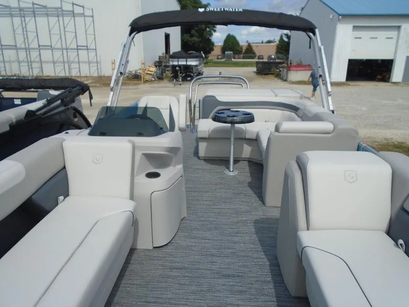 Slide: The Image of 2025 Godfrey Sweetwater 2286 C pontoon boat interior with seating and table. - 9