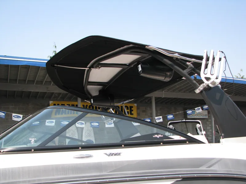 Slide: The Image of 2015 Chaparral Vortex 223 VRX-Surf boat with wakeboard tower and bimini top. - 4