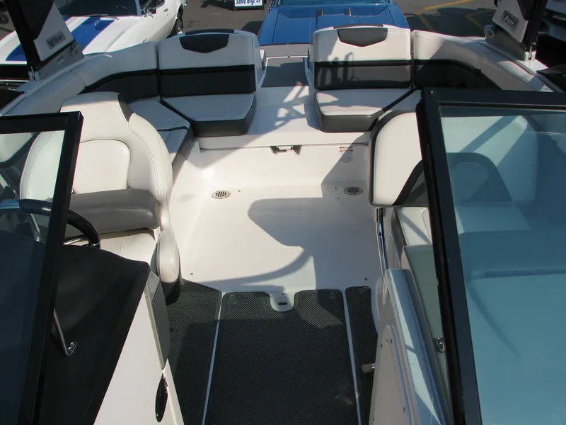 Slide: The Image of 2015 Chaparral Vortex 223 VRX-Surf boat interior with seating and windshield. - 8