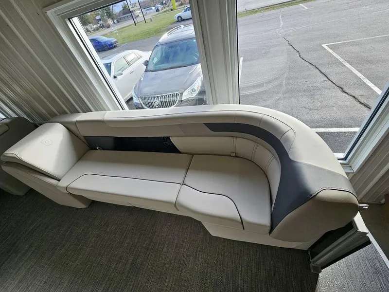 Slide: The Image of 2025 Godfrey Sweetwater 2286 C boat interior with beige seating. - 11