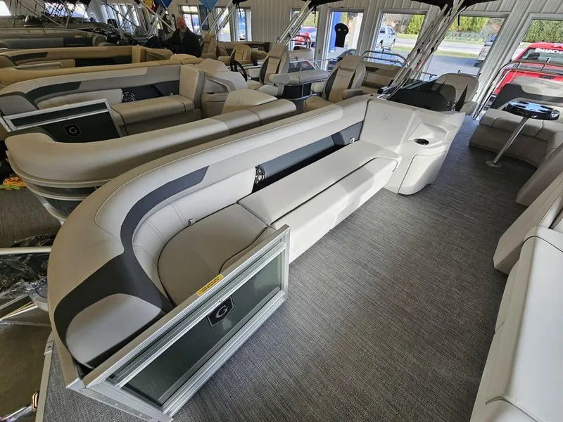 Slide: The Image of 2025 Godfrey Sweetwater 2286 C pontoon boat interior with plush seating and modern design. - 12