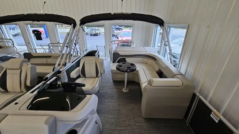 Slide: The Image of 2025 Godfrey Sweetwater 2286 C pontoon boat interior with seating and table. - 3