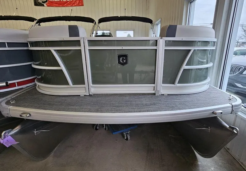 Slide: The Image of 2025 Godfrey Sweetwater 2286 C pontoon boat in showroom, front view. - 4