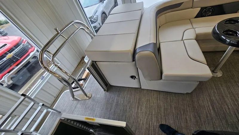 Slide: The Image of Interior of 2025 Godfrey Sweetwater 2286 C pontoon boat with plush seating and modern design. - 5