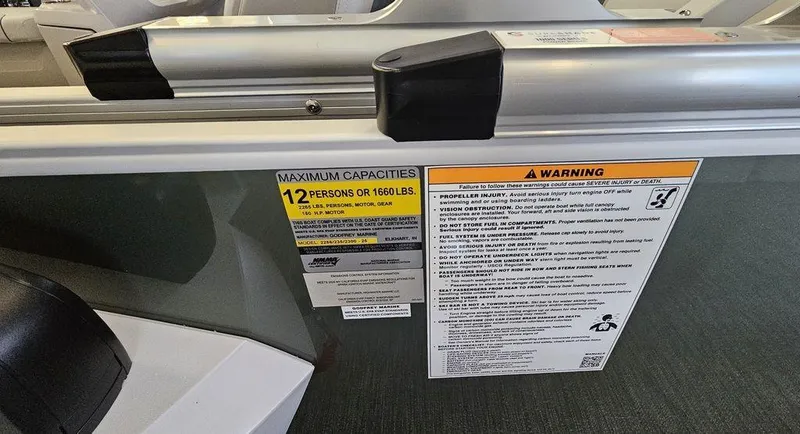 Slide: The Image of Capacity and warning labels on 2025 Godfrey Sweetwater 2286 C boat. - 7