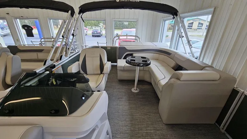 Slide: The Image of 2025 Godfrey Sweetwater 2286 C pontoon boat interior with plush seating and sleek design. - 8