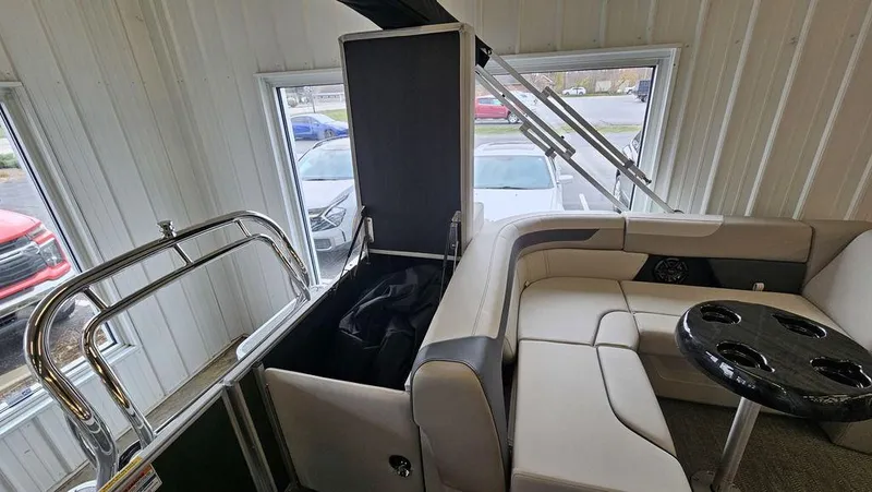 Slide: The Image of 2025 Godfrey Sweetwater 2286 C interior with seating and storage compartment. - 9