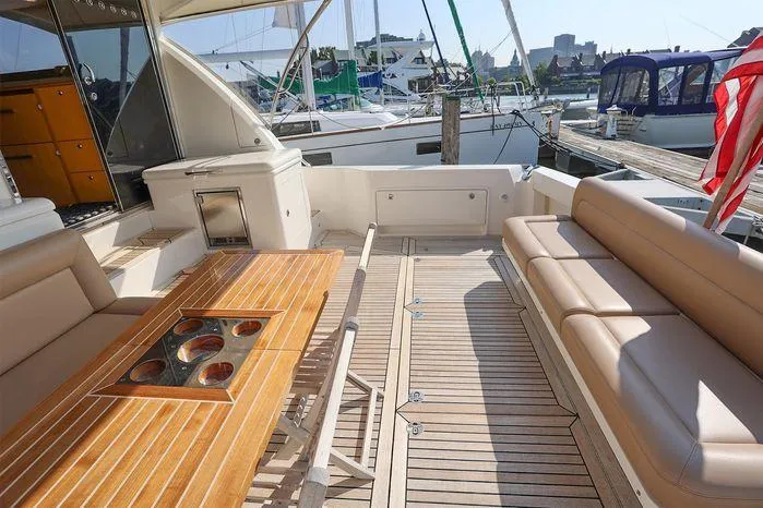 Slide: The Image of Spacious deck of 2016 Riviera 525 SUV yacht with seating and table. - 18