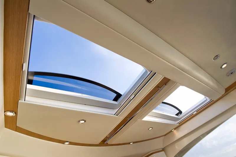 Slide: The Image of Luxurious interior skylight of 2016 Riviera 525 SUV yacht, featuring sleek design and natural lighting. - 25