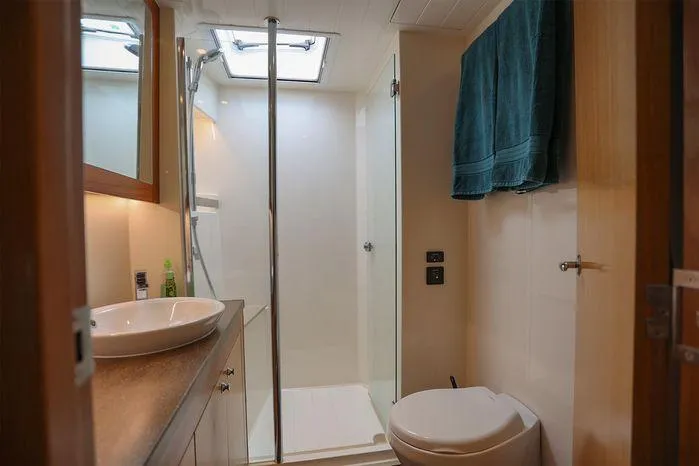 Slide: The Image of Luxurious bathroom in 2016 Riviera 525 SUV yacht with shower and vanity. - 37