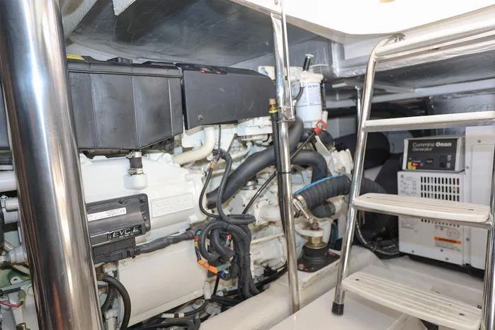 Slide: The Image of Engine room of 2016 Riviera 525 SUV with visible components and ladder. - 44