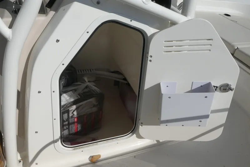 Slide: The Image of Open storage compartment on 2025 Boston Whaler 210 Montauk boat. - 11