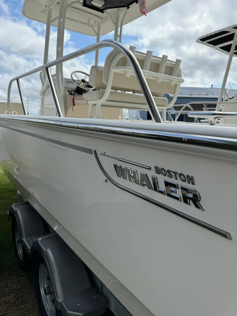 Slide: The Image of 2025 Boston Whaler 210 Montauk boat on trailer, side view. - 12