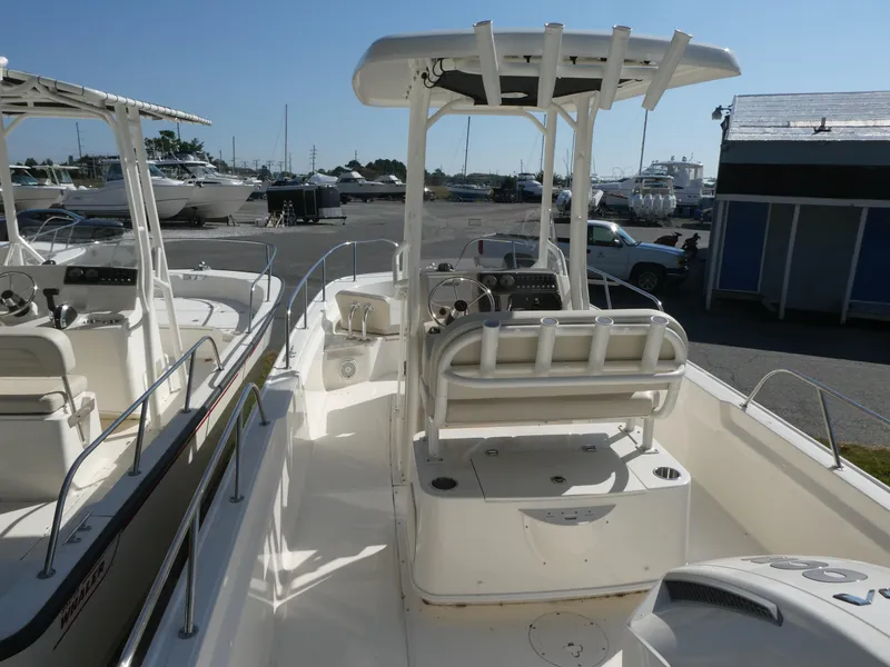 Slide: The Image of 2025 Boston Whaler 210 Montauk boat interior with console and seating. - 4