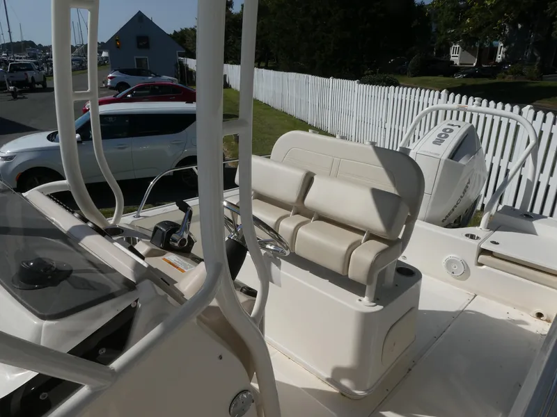 Slide: The Image of 2025 Boston Whaler 210 Montauk boat interior with seating and controls. - 9