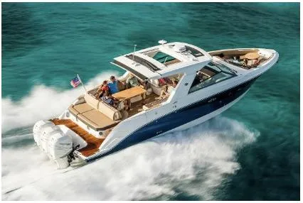 Slide: The Image of 2021 Sea Ray SLX 400 Outboard cruising on clear turquoise water. - 1