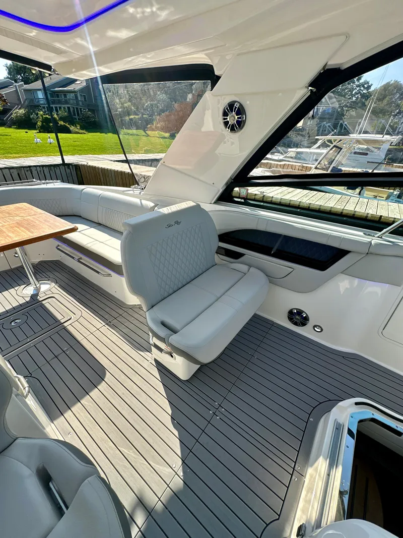 Slide: The Image of 2021 Sea Ray SLX 400 Outboard interior with luxurious seating and sleek design. - 21