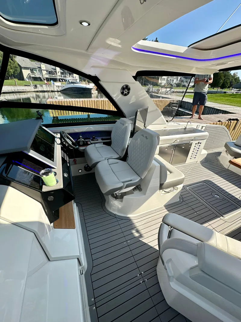 Slide: The Image of 2021 Sea Ray SLX 400 Outboard interior with modern helm and seating. - 22