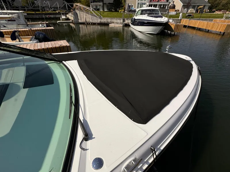 Slide: The Image of 2021 Sea Ray SLX 400 Outboard boat docked in a marina. - 35