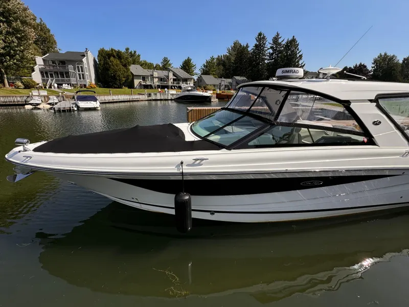 Slide: The Image of 2021 Sea Ray SLX 400 Outboard boat docked in a scenic marina. - 37