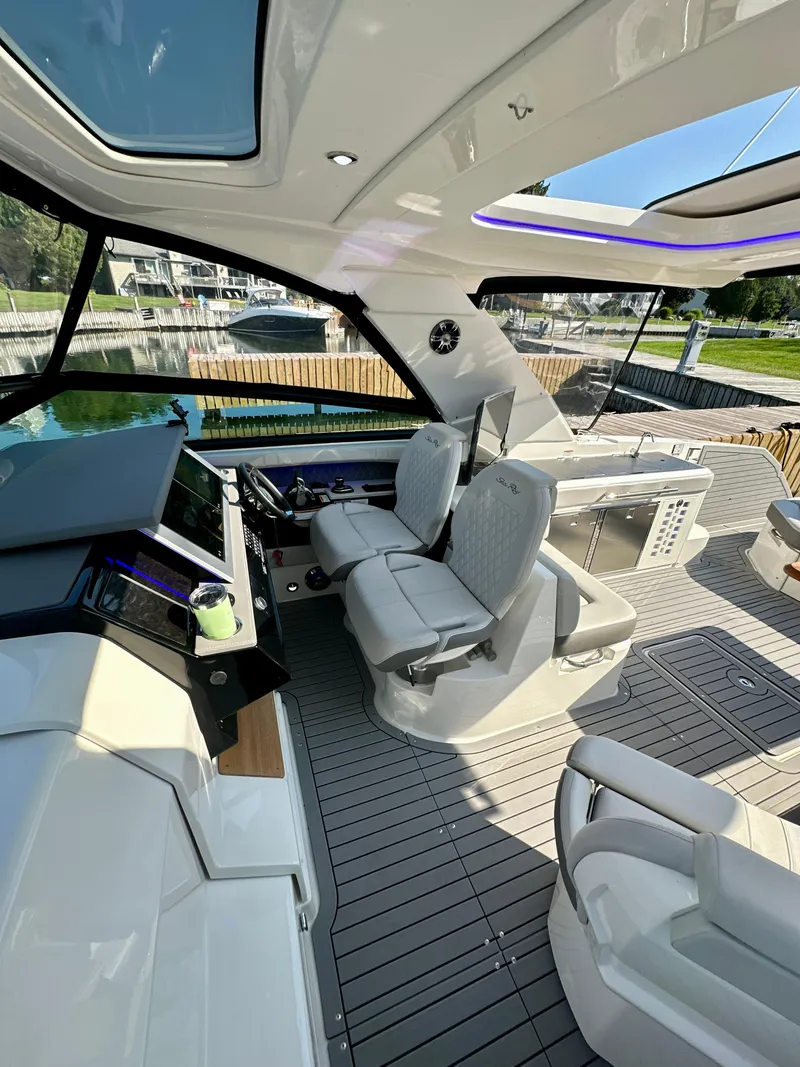 Slide: The Image of 2021 Sea Ray SLX 400 Outboard interior with modern helm and seating. - 7