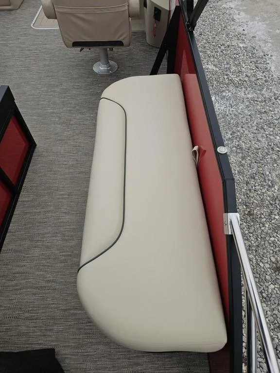 Slide: The Image of 2025 Godfrey Sweetwater 2286 SFL boat interior with beige seating and modern design. - 10