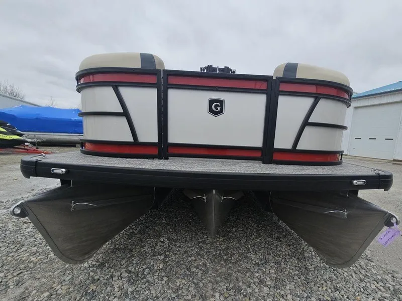 Slide: The Image of 2025 Godfrey Sweetwater 2286 SFL pontoon boat, front view, on gravel surface. - 6