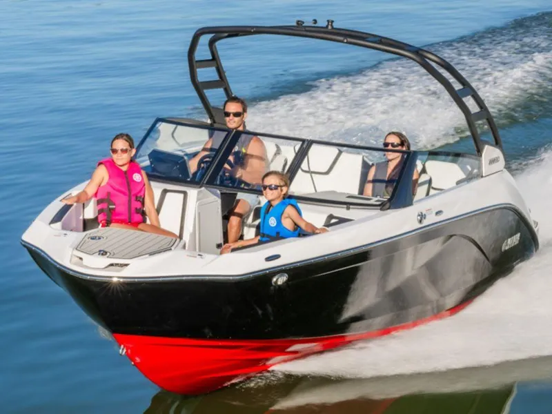 Slide: The Image of 2025 Yamaha Boats 222 SE cruising on water with passengers enjoying the ride. - 4
