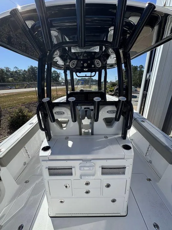 Slide: The Image of 2025 Sportsman Open 282 boat interior with modern helm and seating. - 11