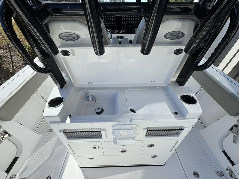 Slide: The Image of 2025 Sportsman Open 282 boat console with sink and storage compartments. - 12