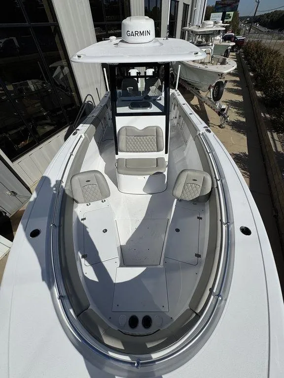 Slide: The Image of 2025 Sportsman Open 282 boat with Garmin equipment, docked at a marina. - 18