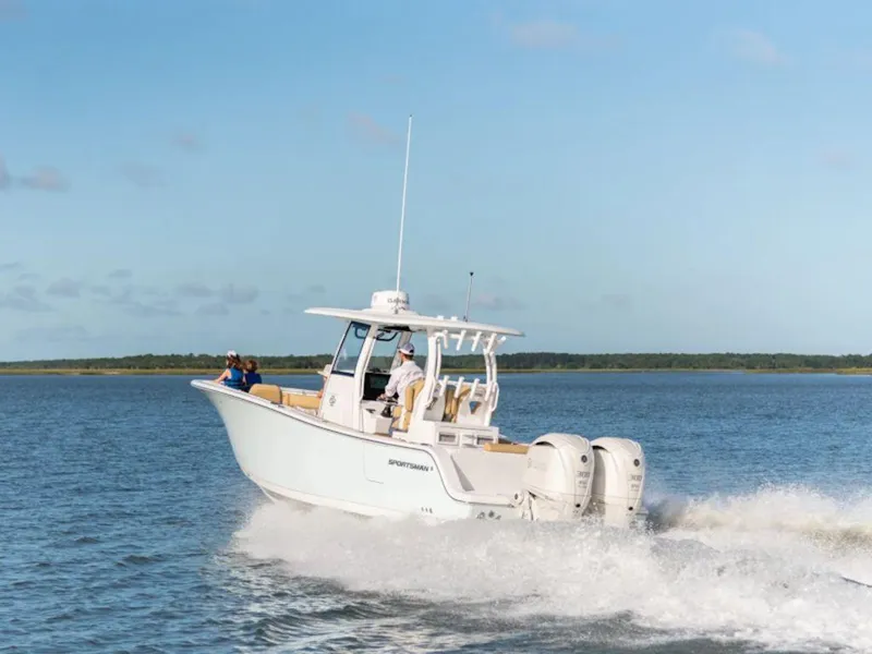 Slide: The Image of 2025 Sportsman Open 282 boat cruising on a calm lake. - 23