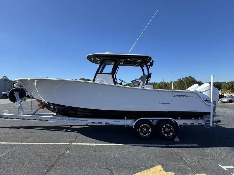 Slide: The Image of 2025 Sportsman Open 282 boat on trailer in parking lot. - 5