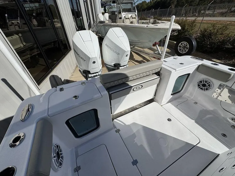 Slide: The Image of 2025 Sportsman Open 282 boat with dual outboard engines, spacious deck, and modern design. - 8