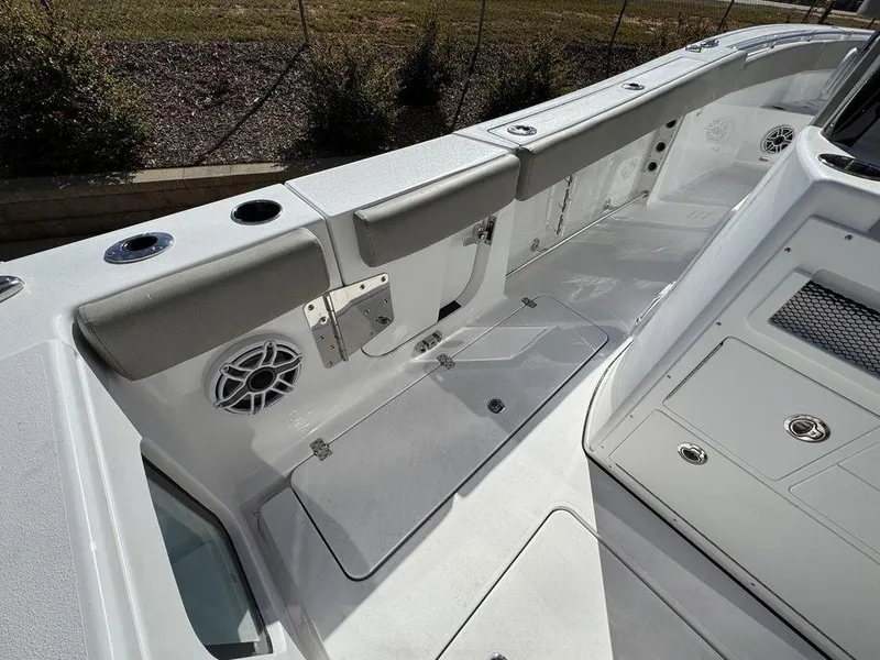 Slide: The Image of 2025 Sportsman Open 282 boat interior with seating, storage, and speakers. - 9