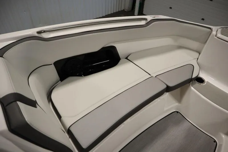 Slide: The Image of 2025 Yamaha Boats 250 SX interior seating, white and gray upholstery. - 13